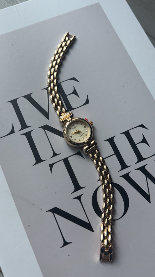 Gold round vintage watch