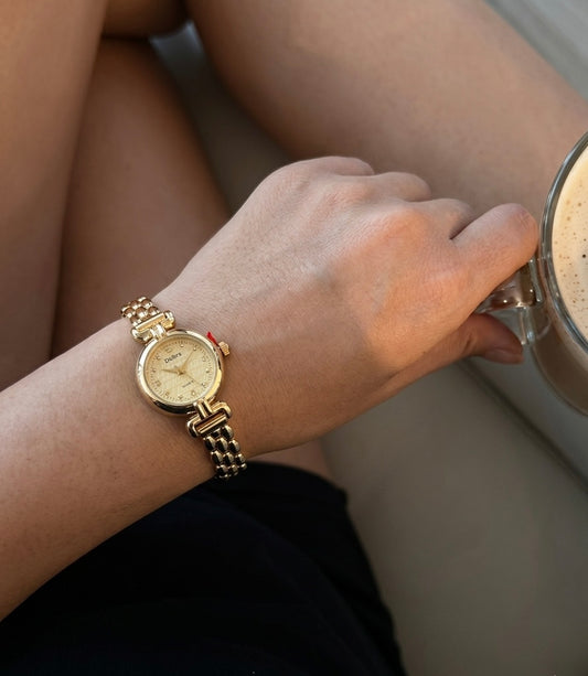 Gold round vintage watch