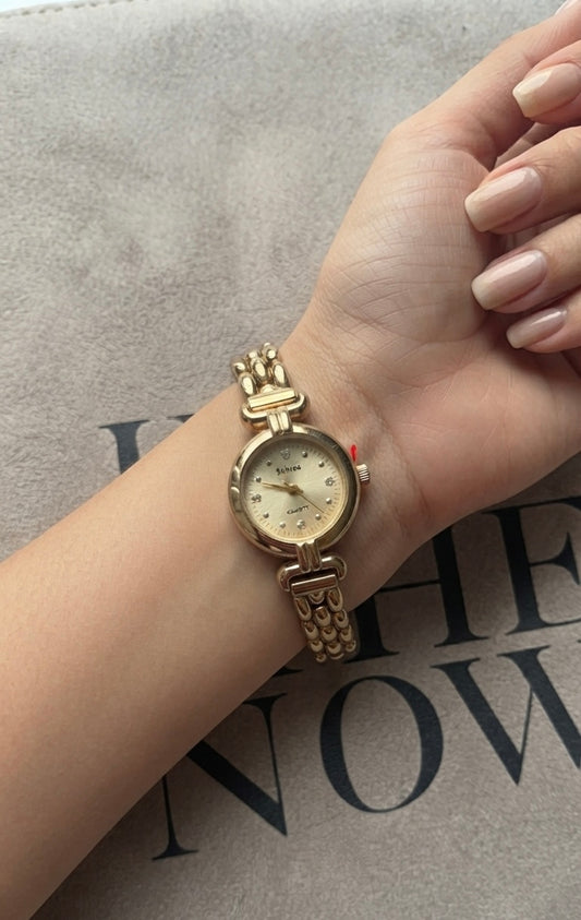 Gold round vintage watch