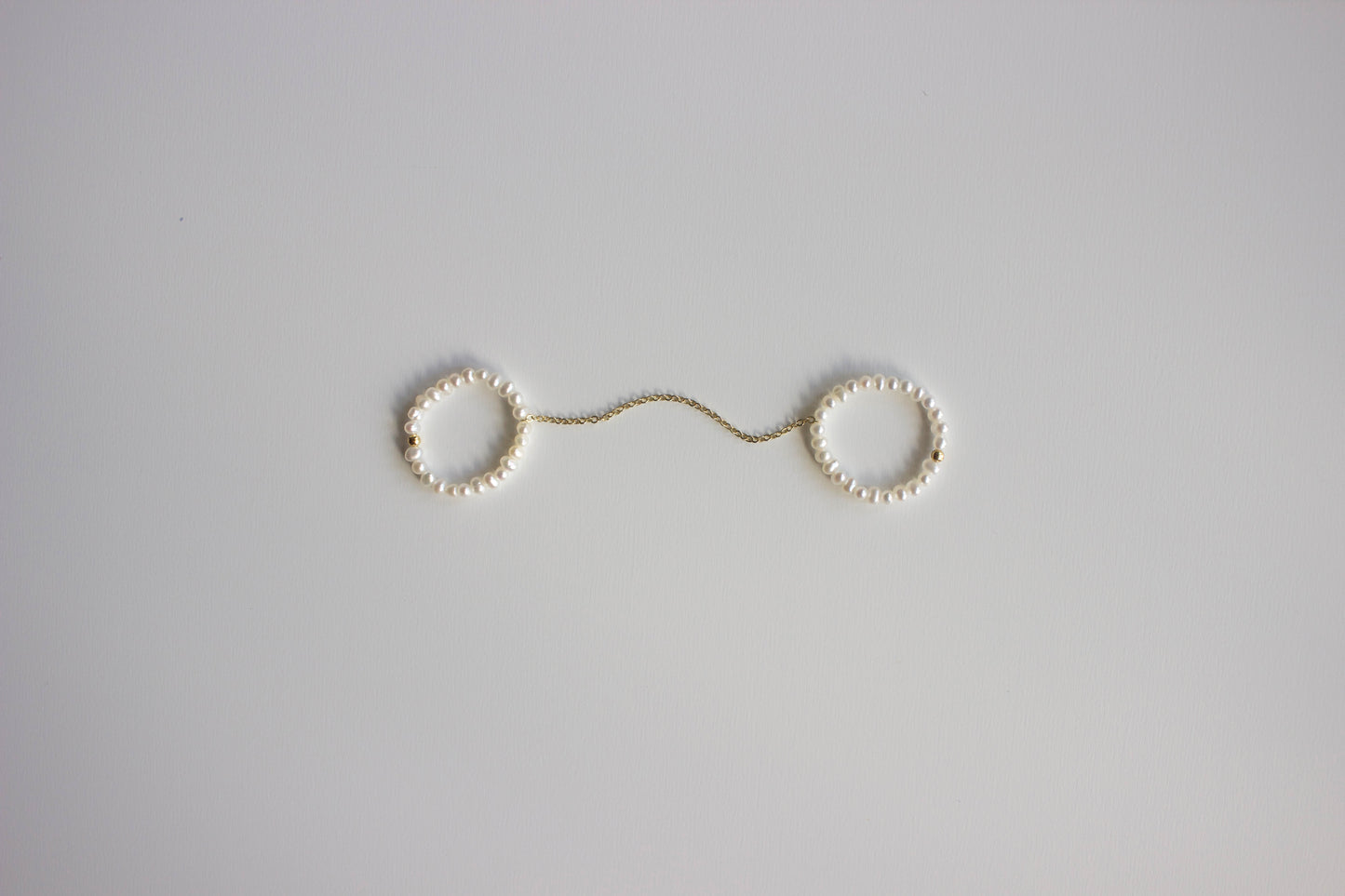 Double pearl ring with chain